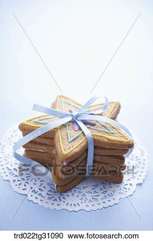 The star shaped cookie with the blue ribbon View Large Photo Image Stock Image - The star shaped cookie with the blue ribbon . Fotosearch