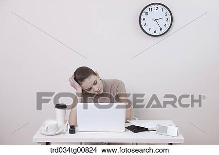 Picture - The stressful woman in the office. Fotosearch