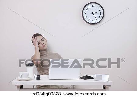 Stock Photo - The stressful woman in the office. Fotosearch