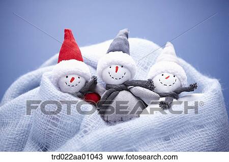The three snowmen in the blue knit muffler View Large Photo Image Stock Image - The three snowmen in the blue knit muffler. Fotosearch