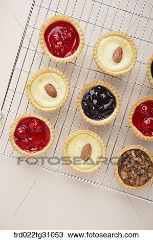 Stock Image - The various kinds of tart on the baking ware. Fotosearch