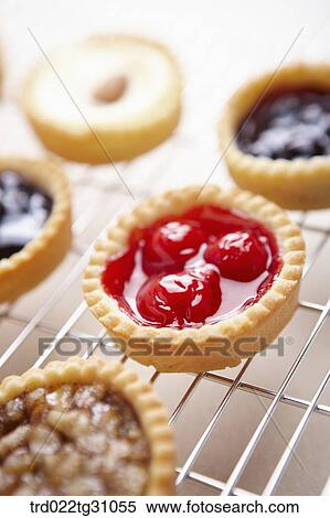 The various kinds of tart on the baking ware View Large Photo Image Stock Photography - The various kinds of tart on the baking ware. Fotosearch