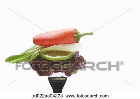Stock Image - The vegetable speared with the fork. Fotosearch