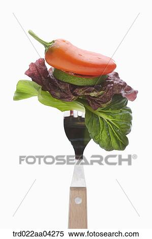Stock Photography - The vegetable speared with the fork. Fotosearch