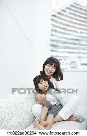 The woman and girl hugging together View Large Photo Image Picture - The woman and girl hugging together . Fotosearch