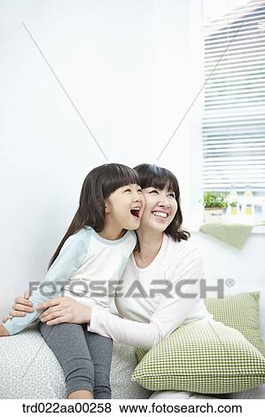 The woman and girl smiling together View Large Photo Image Stock Photo - The woman and girl smiling together. Fotosearch