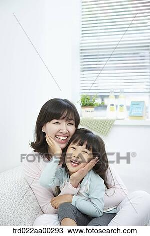 The woman and girl touching each other's face View Large Photo Image Stock Image - The woman and girl touching each other's face. Fotosearch