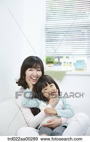 The woman and girl touching each other's face View Large Photo Image Stock Photo - The woman and girl touching each other's face. Fotosearch