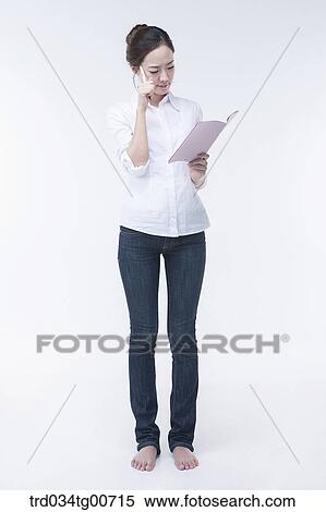 The woman concerning over notebook View Large Photo Image Stock Photography - The woman concerning over notebook. Fotosearch