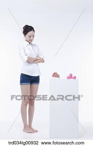The woman concerning over the doughnuts View Large Photo Image Stock Image - The woman concerning over the doughnuts. Fotosearch