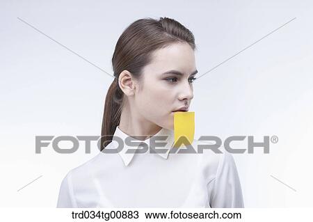 The woman having the sticky note below her lips View Large Photo Image Stock Image - The woman having the sticky note below her lips . Fotosearch