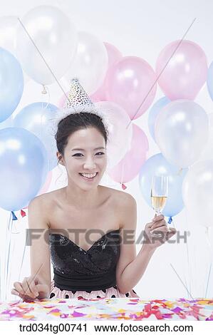 The woman holding wine glass with colorful balloons View Large Photo Image Stock Image - The woman holding wine glass with colorful balloons. Fotosearch