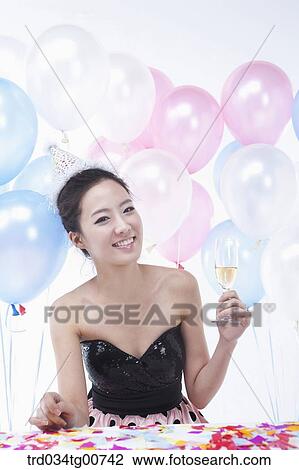 The woman holding wine glass with colorful balloons View Large Photo Image Stock Image - The woman holding wine glass with colorful balloons. Fotosearch