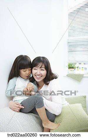 The woman hugging the girl with big smile View Large Photo Image Stock Image - The woman hugging the girl with big smile. Fotosearch