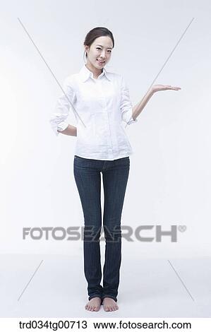 The woman presenting with one hand View Large Photo Image Stock Image - The woman presenting with one hand. Fotosearch