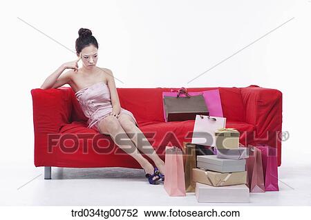 The woman staring at shopping bags View Large Photo Image Stock Image - The woman staring at shopping bags. Fotosearch