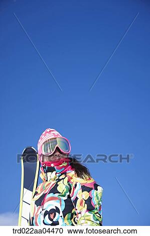 The woman wearing snowboarding wear with the ski board View Large Photo Image Stock Image - The woman wearing snowboarding wear with the ski board. Fotosearch