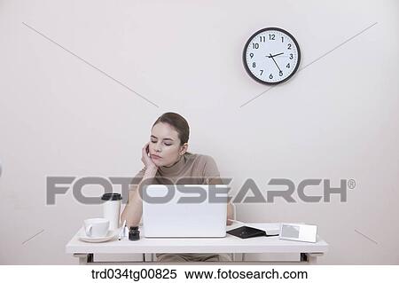 Stock Photography - The worrying woman in the office. Fotosearch