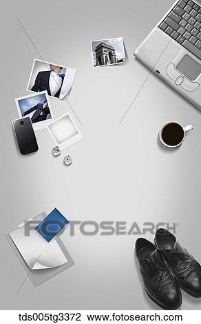 The businessman desk with various stuffs around View Large Illustration Drawing - The businessman desk with various stuffs around. Fotosearch