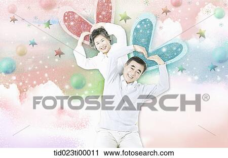 Clip Art - The old couple making the heart over their heads. Fotosearch