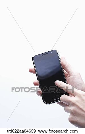 Stock Photo - A finger touching on the Smartphone . Fotosearch