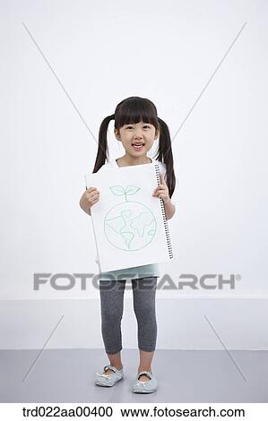 Stock Image - A girl holding green globe painting. Fotosearch