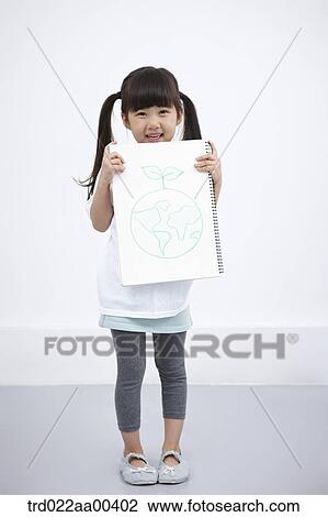 Stock Image - A girl holding green globe painting. Fotosearch