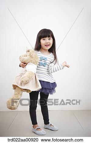 A girl holding teddy bear View Large Photo Image Stock Image - A girl holding teddy bear. Fotosearch