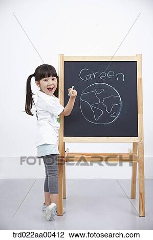 Stock Image - A girl painting green globe on blackboard . Fotosearch