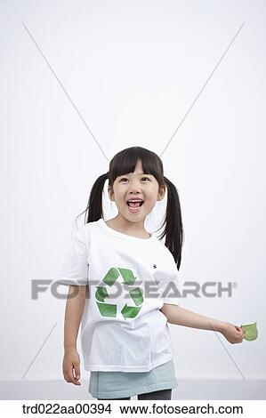A girl wearing recycling shirt with green leaf View Large Photo Image Picture - A girl wearing recycling shirt with green leaf. Fotosearch