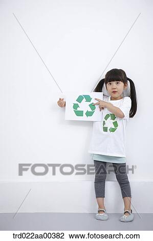 A girl wearing recycling shirt with recycling mark View Large Photo Image Stock Image - A girl wearing recycling shirt with recycling mark . Fotosearch
