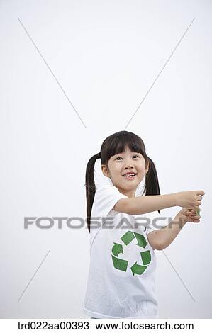 Stock Image - A girl wearing recycling shirt with green leaf. Fotosearch
