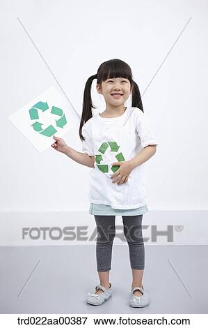 A girl wearing recycling shirt with recycling mark View Large Photo Image Stock Photo - A girl wearing recycling shirt with recycling mark . Fotosearch