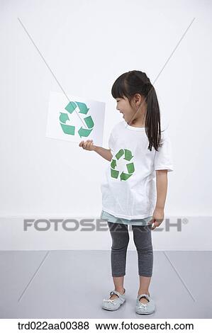 A girl wearing recycling shirt with recycling mark View Large Photo Image Stock Photo - A girl wearing recycling shirt with recycling mark . Fotosearch