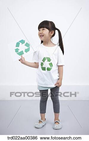 A girl wearing recycling shirt with recycling mark View Large Photo Image Stock Photograph - A girl wearing recycling shirt with recycling mark . Fotosearch