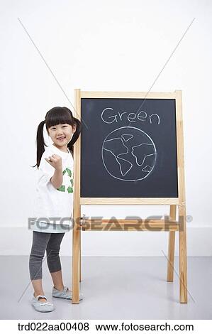 A girl with green globe painting on blackboard View Large Photo Image Stock Photo - A girl with green globe painting on blackboard . Fotosearch