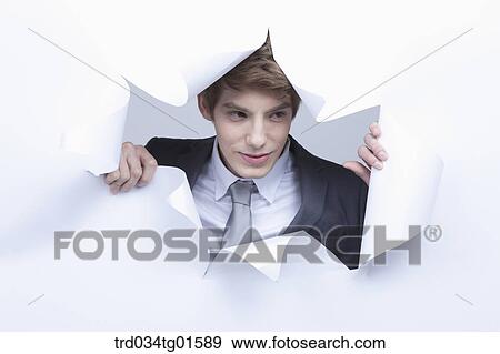 Stock Photo - A man from the torn paper. Fotosearch