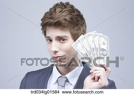 A man holding the money View Large Photo Image Picture - A man holding the money. Fotosearch