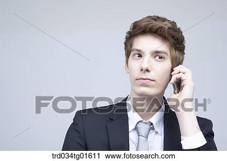 A man listening to the smart phone View Large Photo Image Stock Image - A man listening to the smart phone. Fotosearch