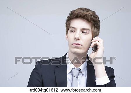A man listening to the smart phone View Large Photo Image Stock Image - A man listening to the smart phone. Fotosearch