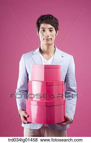 A man preparing the event with gift View Large Photo Image Stock Photo - A man preparing the event with gift . Fotosearch