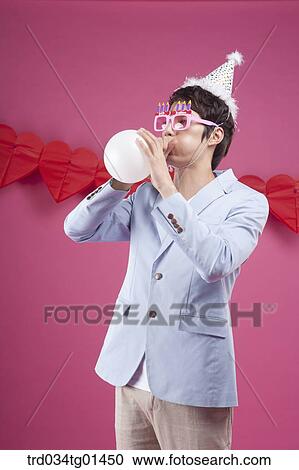 A man preparing the party event with balloon View Large Photo Image Stock Image - A man preparing the party event with balloon. Fotosearch