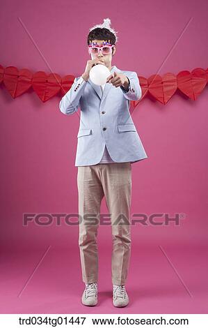 A man preparing the party event with balloon View Large Photo Image Stock Photo - A man preparing the party event with balloon. Fotosearch