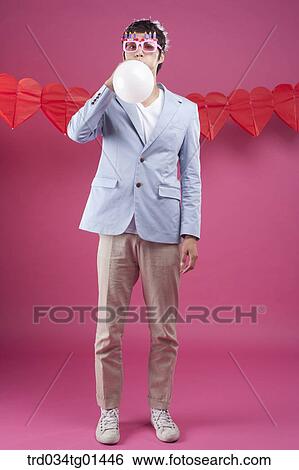 A man preparing the party event with balloon View Large Photo Image Stock Photograph - A man preparing the party event with balloon. Fotosearch