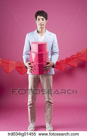 A man preparing the party event with gift View Large Photo Image Stock Photography - A man preparing the party event with gift . Fotosearch