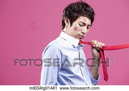 A man pulled with his red tie View Large Photo Image Stock Image - A man pulled with his red tie. Fotosearch