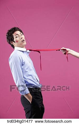 A man pulled with his red tie View Large Photo Image Stock Photo - A man pulled with his red tie. Fotosearch