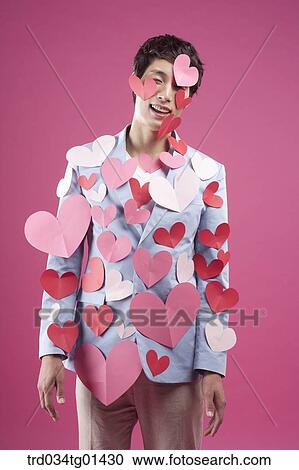 A man putting heart on the body View Large Photo Image Stock Image - A man putting heart on the body. Fotosearch