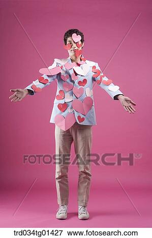 Stock Photo - A man putting heart on the body. Fotosearch