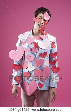 A man putting heart on the body View Large Photo Image Stock Photo - A man putting heart on the body. Fotosearch